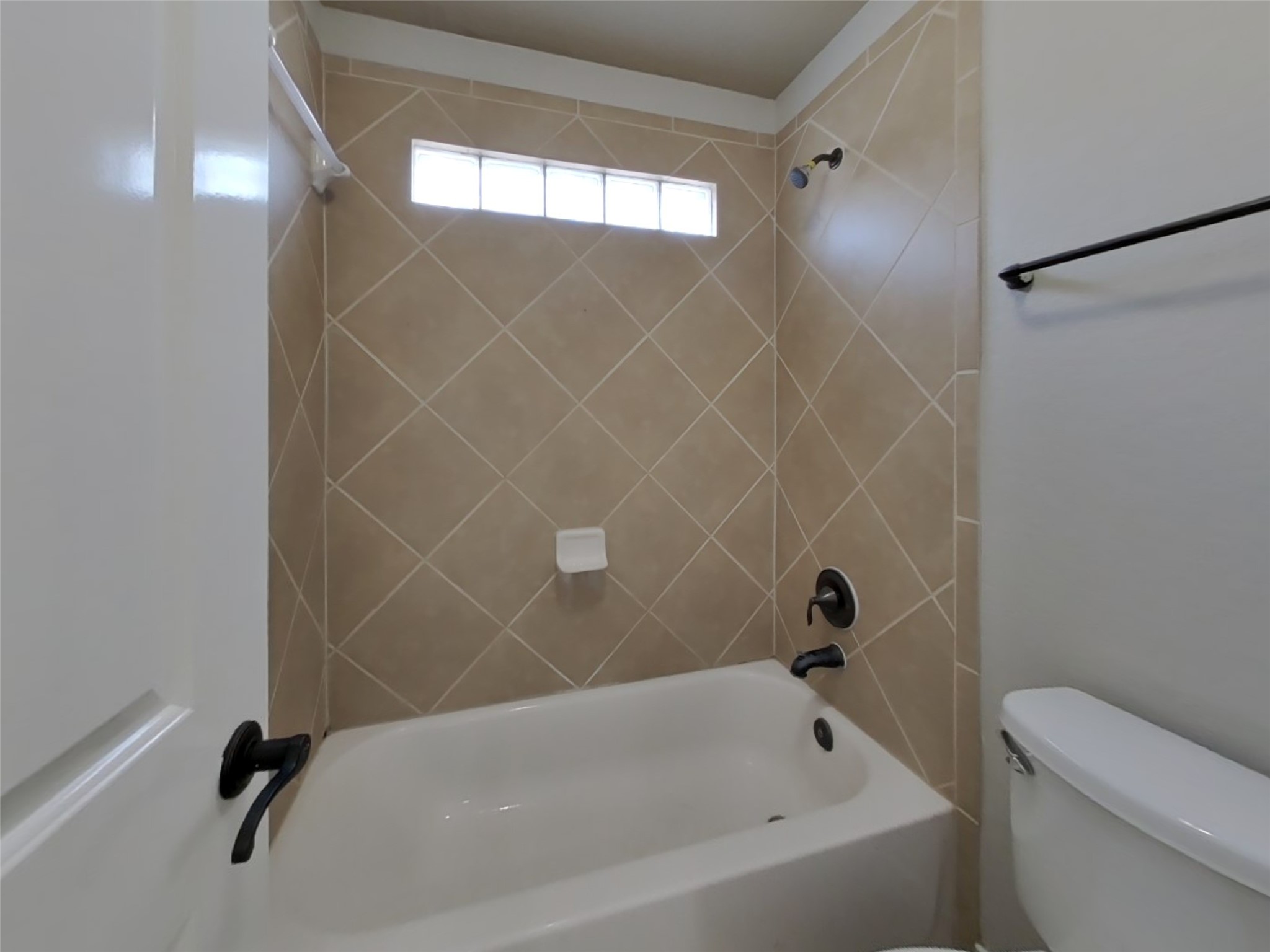 1819 Jara Court Spring, TX 77388 - Photo 17 of 19 a bathroom with a bathtub and a toilet