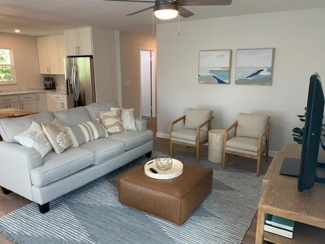 a living room with furniture and a table