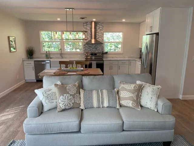 a living room with furniture and a large window