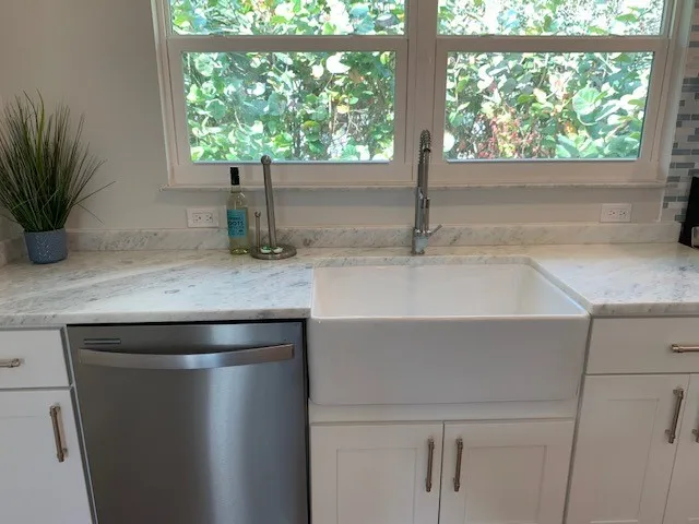 a kitchen with a sink and a window