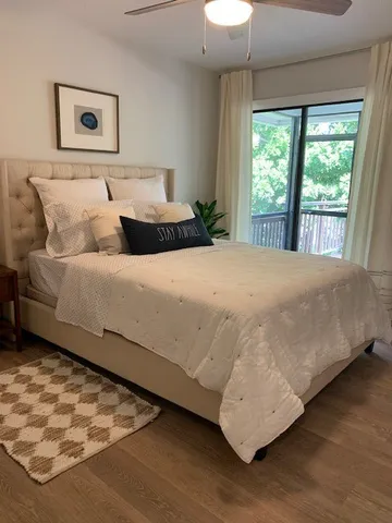 a bedroom with a bed and a couch