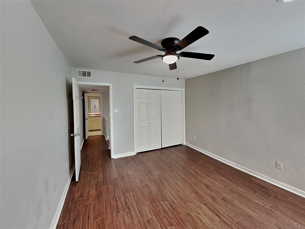 2201 Park Hill Drive Fort Worth, TX 76110 - Photo 8 of 14 a view of an empty room and wooden floor
