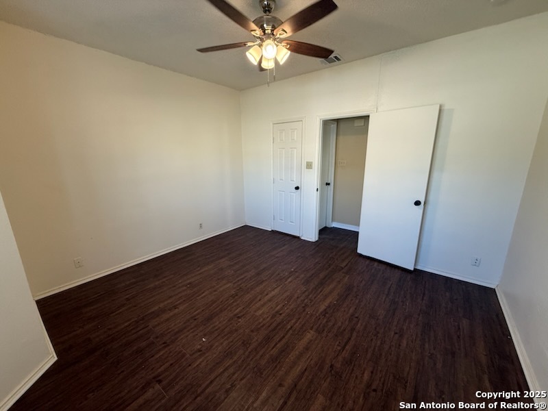 3420 Ridge Smoke San Antonio, TX 78247 - Photo 12 of 20 an empty room with wooden floor and a ceiling fan