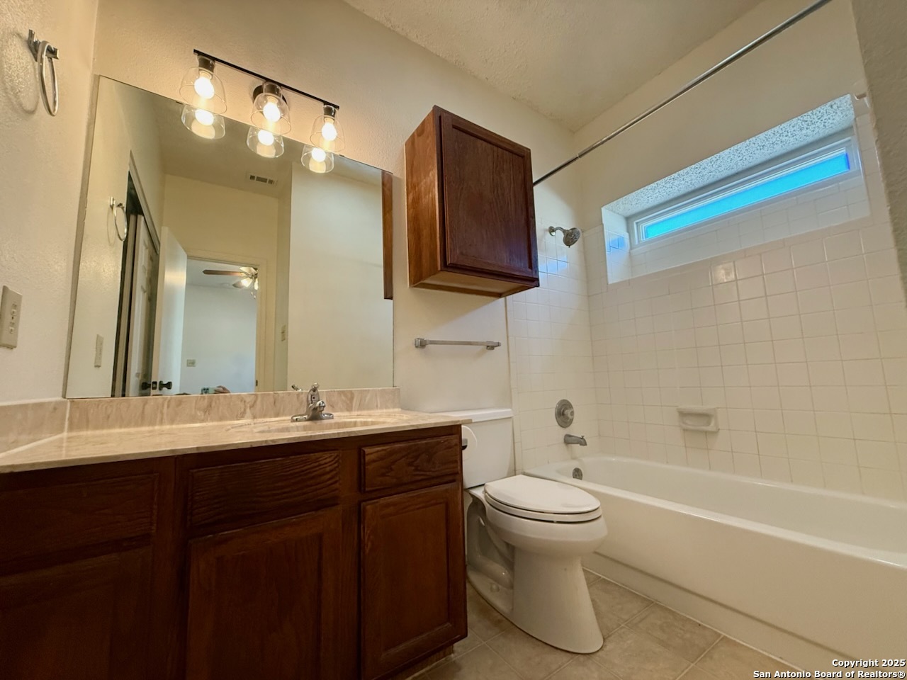 3420 Ridge Smoke San Antonio, TX 78247 - Photo 17 of 20 a bathroom with a toilet sink and mirror