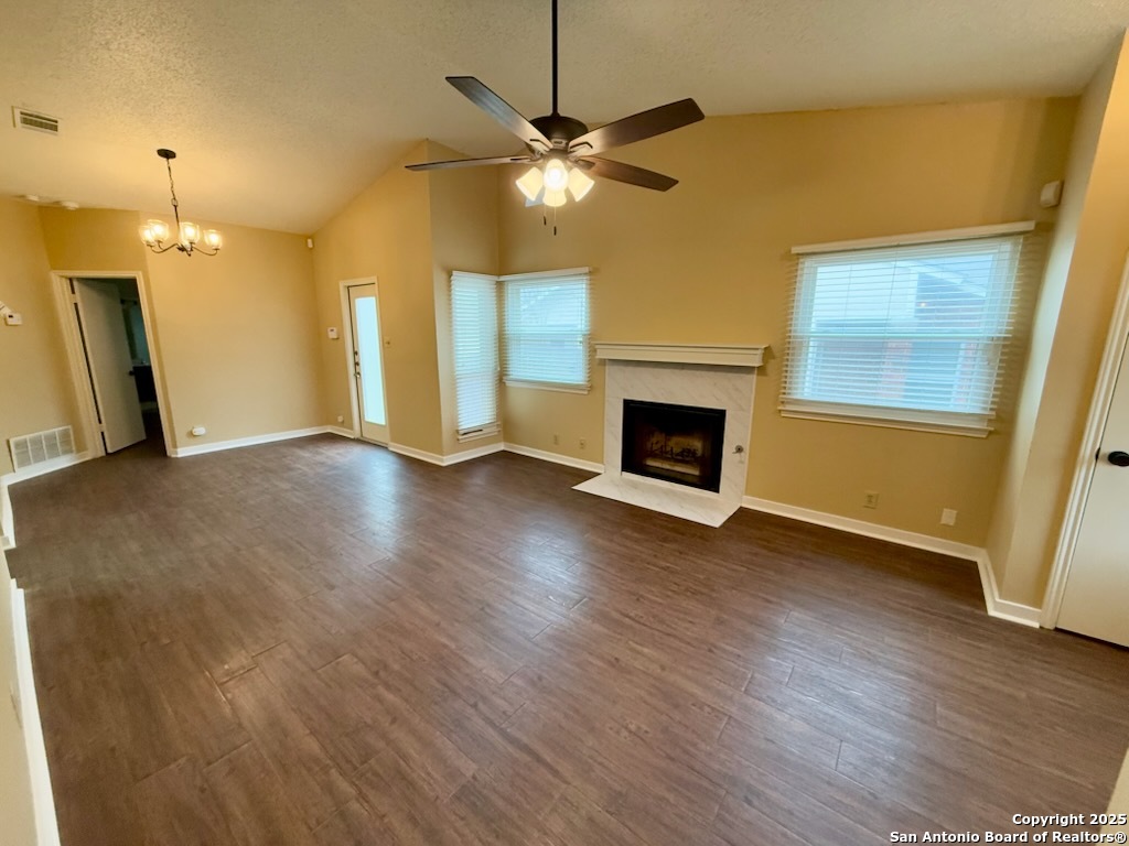 3420 Ridge Smoke San Antonio, TX 78247 - Photo 4 of 20 a view of an empty room with a fireplace and a window