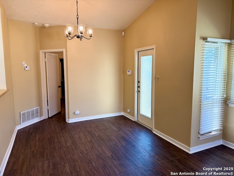 3420 Ridge Smoke San Antonio, TX 78247 - Photo 6 of 20 an empty room with wooden floor and windows
