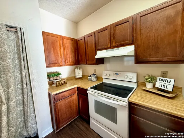a kitchen with a stove and a microwave