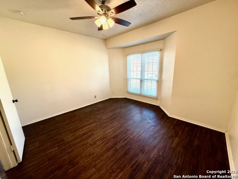 3420 Ridge Smoke San Antonio, TX 78247 - Photo 10 of 20 a view of an empty room with wooden floor and a window