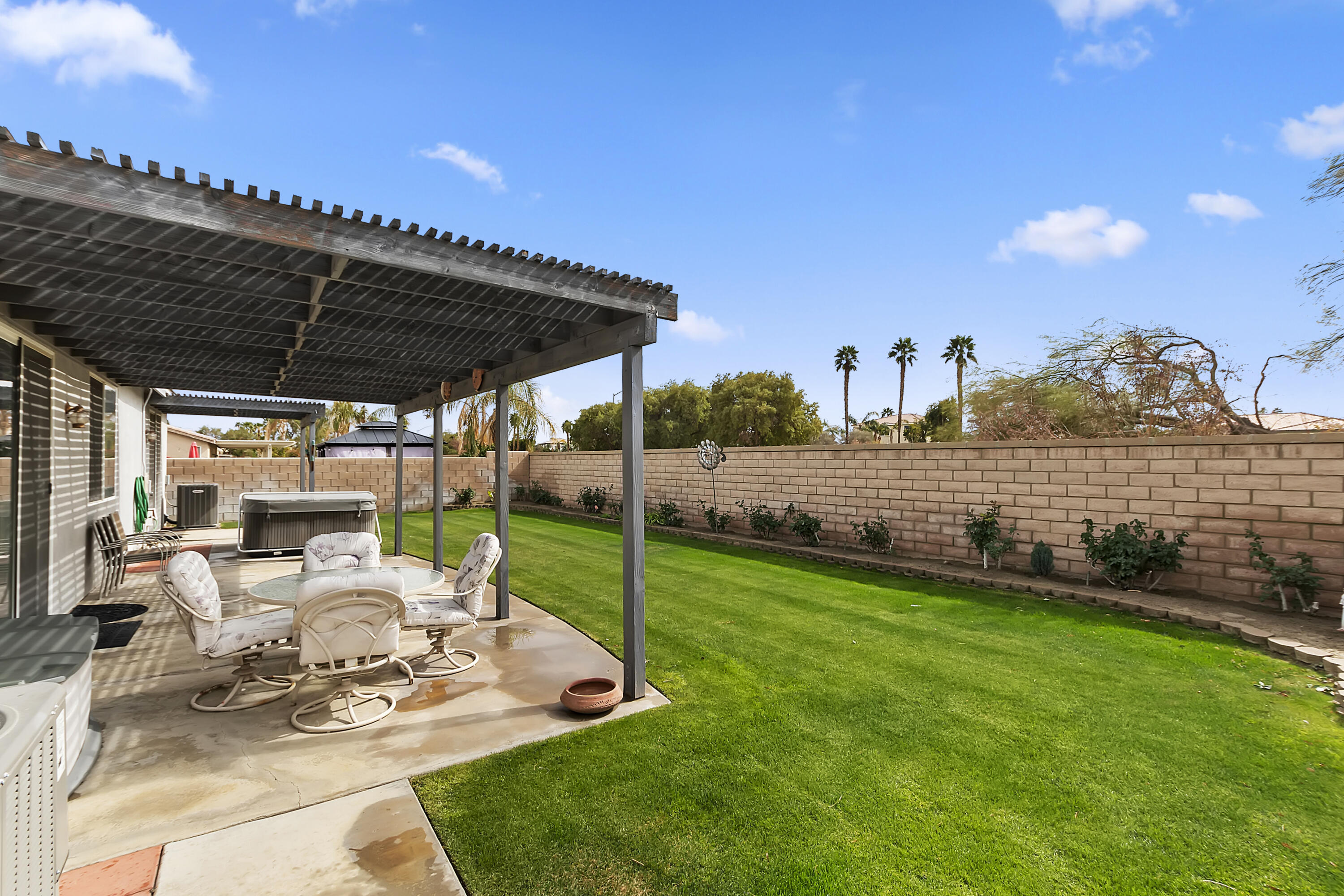80733 Diamondback Trail Indio, CA 92201 - Photo 13 of 16 a view of a porch with furniture and garden