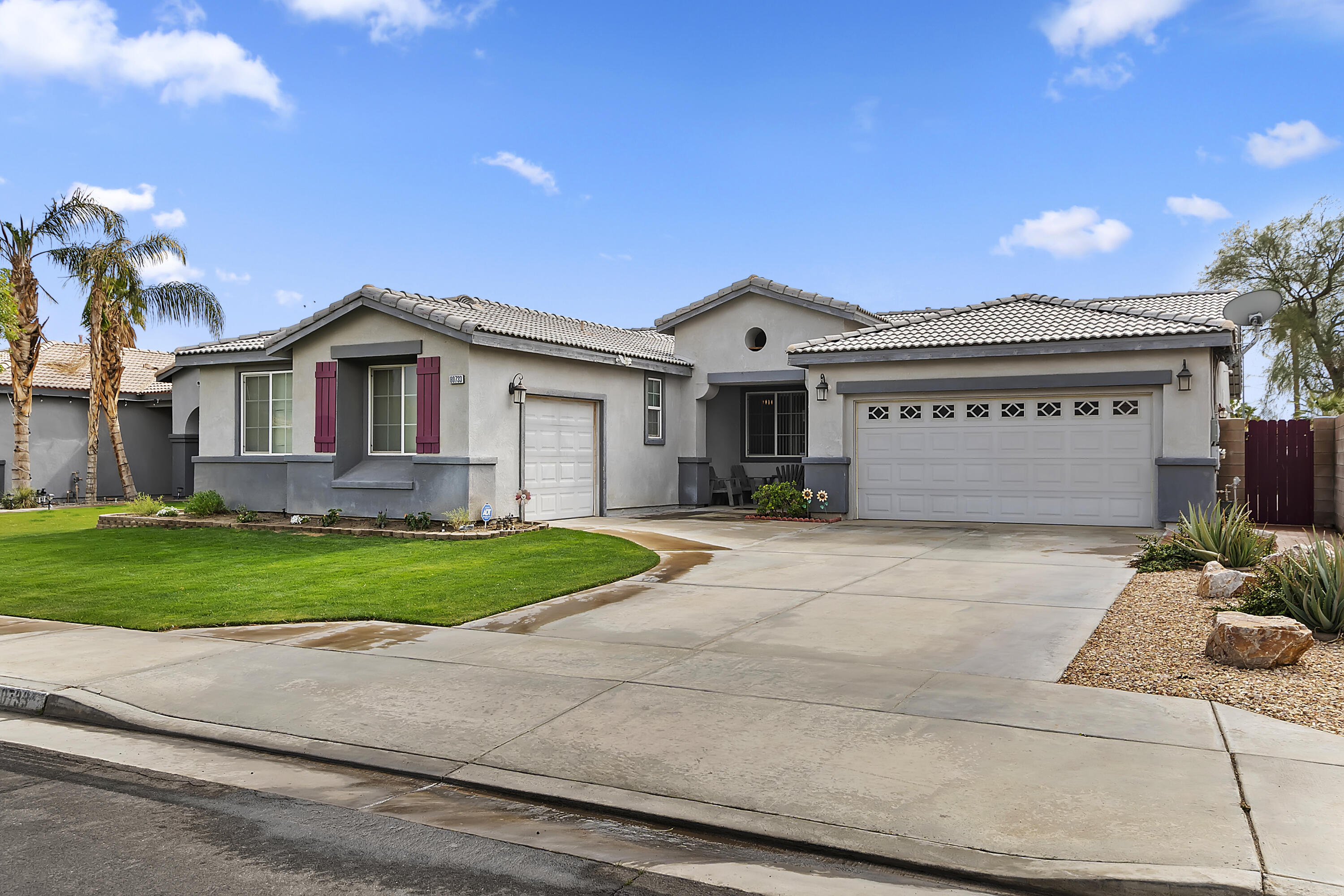 80733 Diamondback Trail Indio, CA 92201 - Photo 2 of 16 a front view of a house with a yard and garage