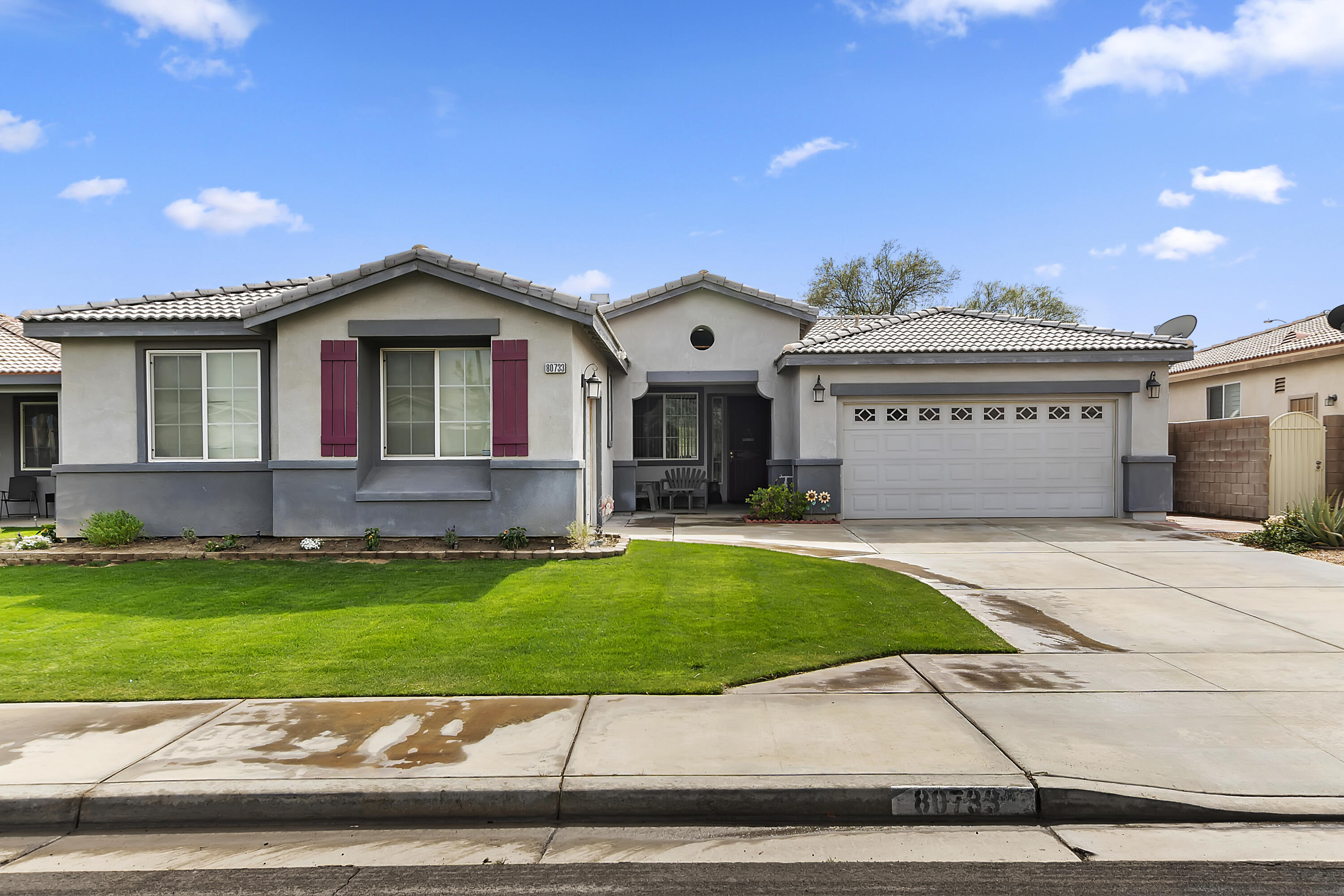 80733 Diamondback Trail Indio, CA 92201 - Photo 3 of 16 a front view of a house with a yard