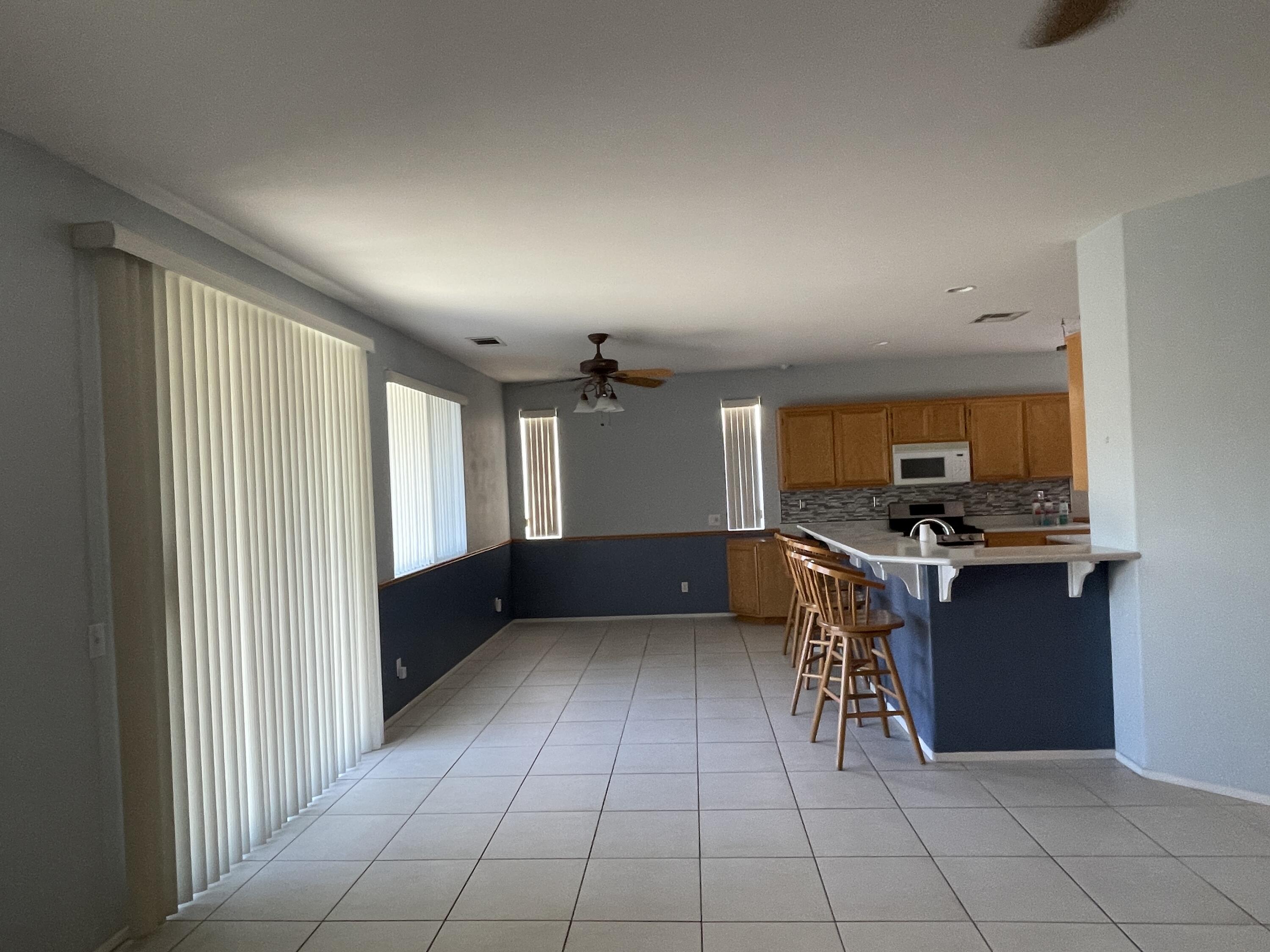 80733 Diamondback Trail Indio, CA 92201 - Photo 5 of 16 a kitchen with stainless steel appliances granite countertop a refrigerator and a stove