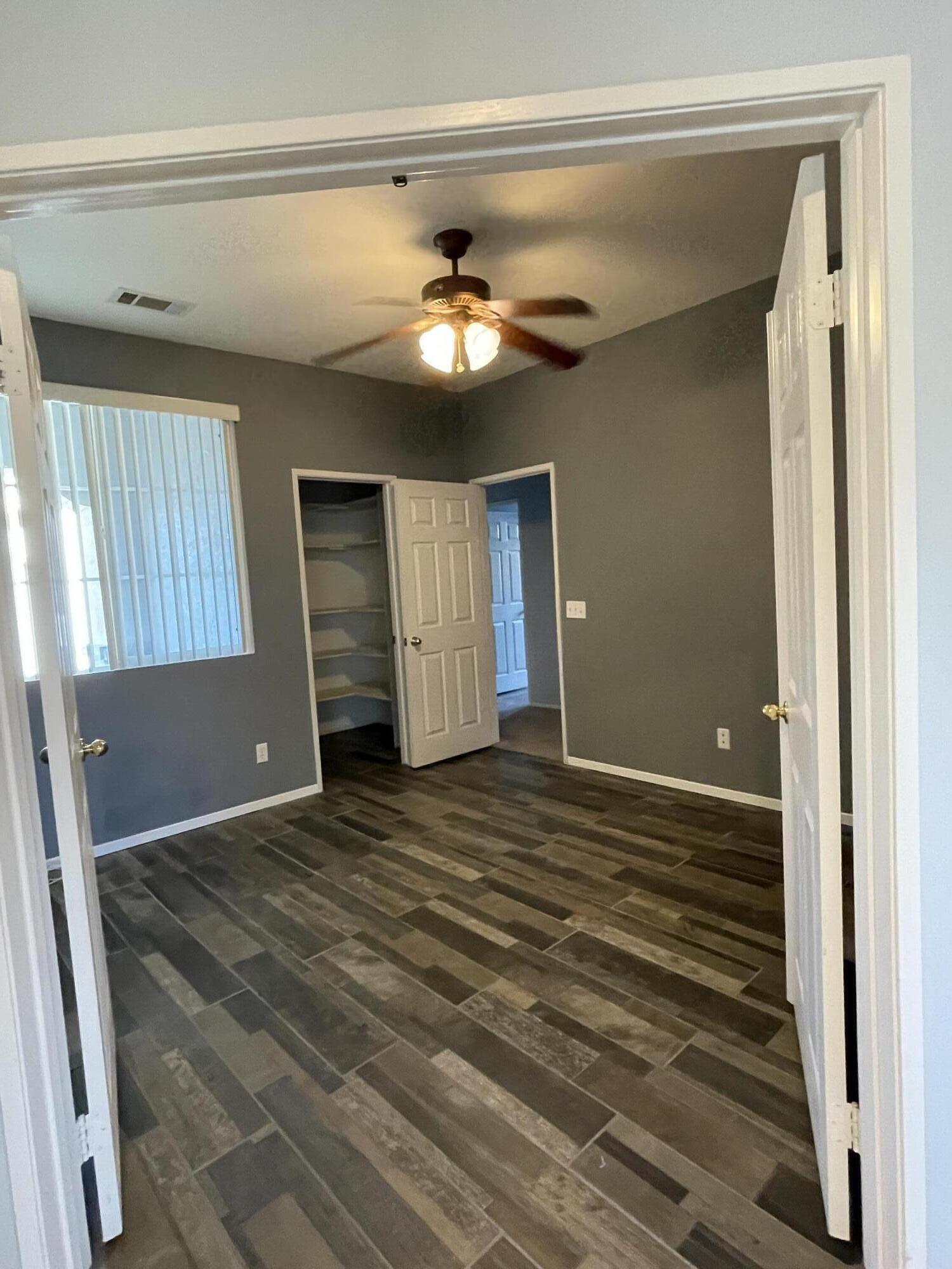 80733 Diamondback Trail Indio, CA 92201 - Photo 8 of 16 a view of a livingroom with a ceiling fan and window
