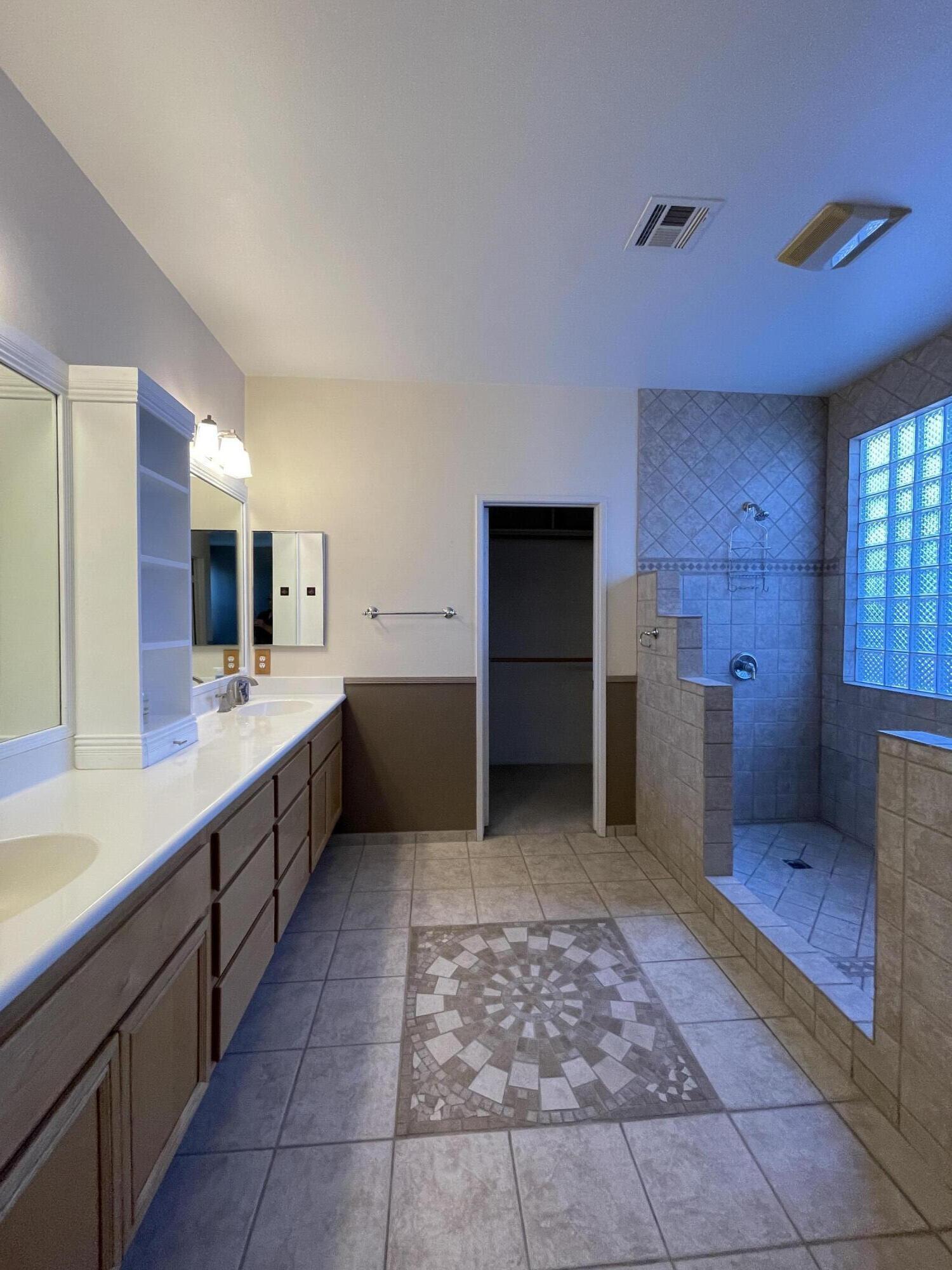 80733 Diamondback Trail Indio, CA 92201 - Photo 10 of 16 a large bathroom with a sink and a large mirror