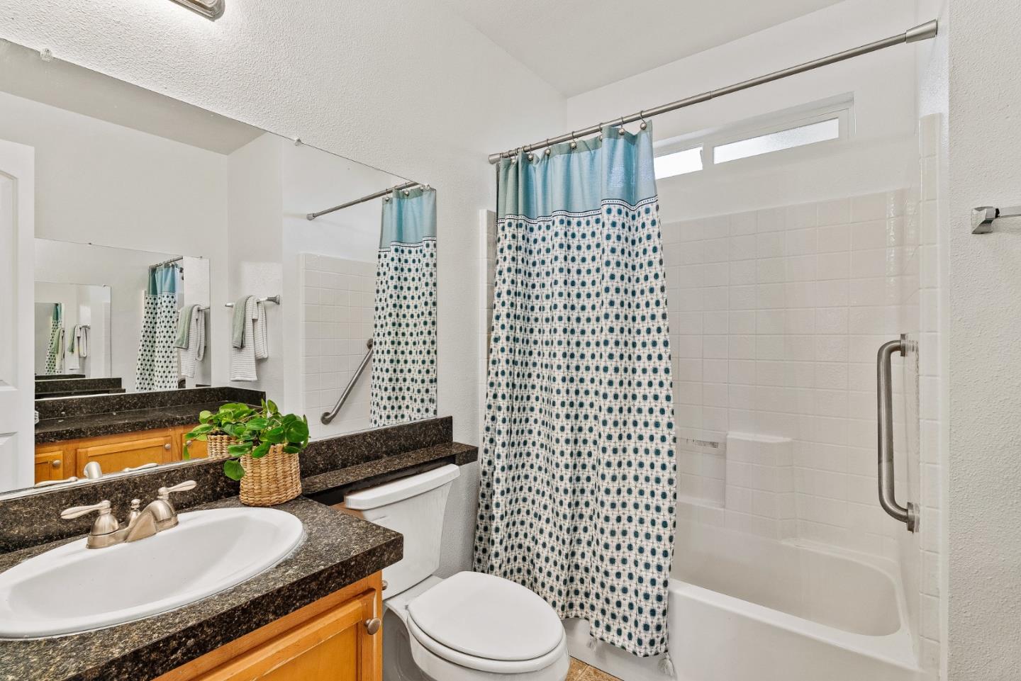 4160 Jade Street, Unit 90 Capitola, CA 95010 - Photo 13 of 18 a bathroom with a sink toilet and shower