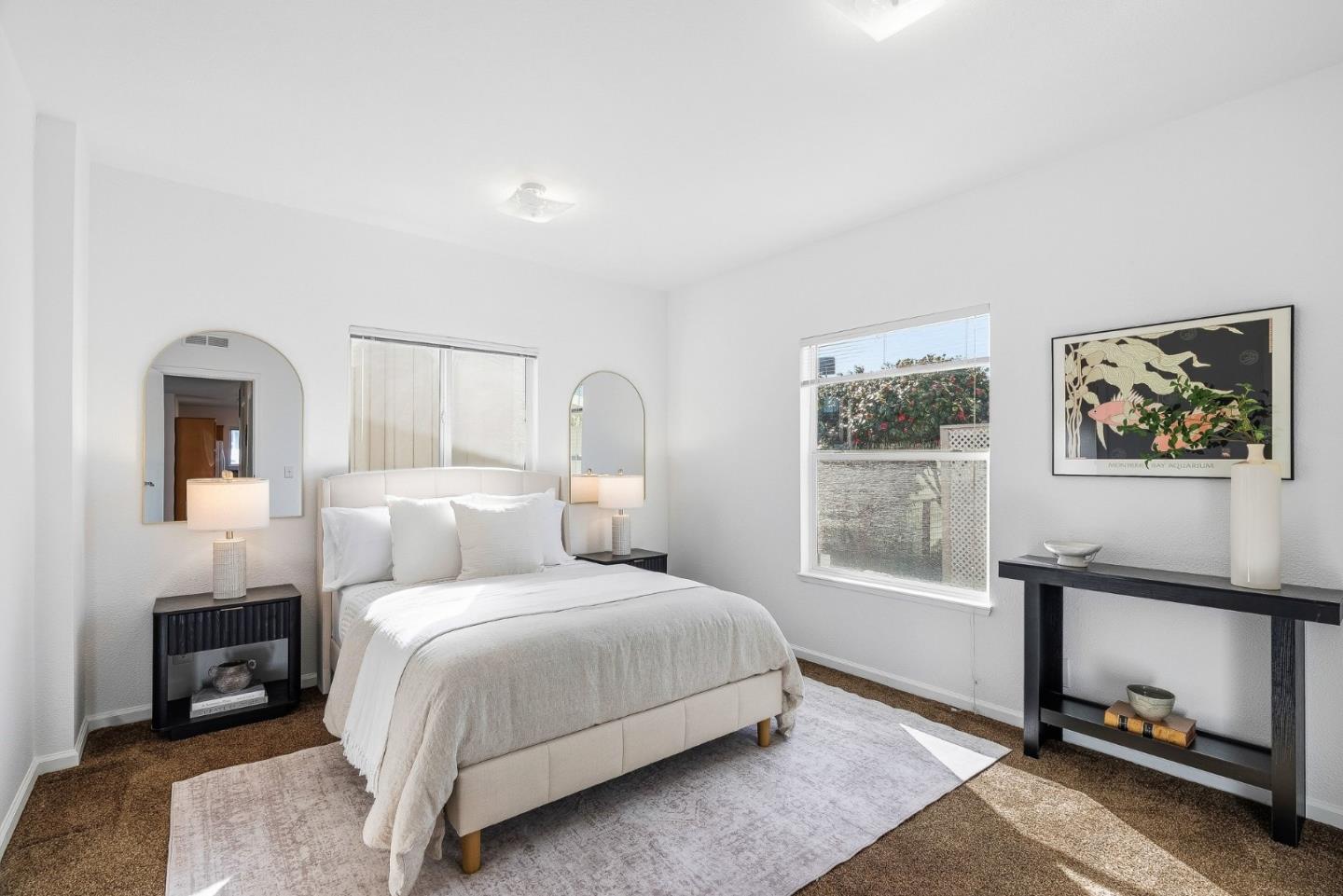4160 Jade Street, Unit 90 Capitola, CA 95010 - Photo 15 of 18 a bedroom with a bed and a window