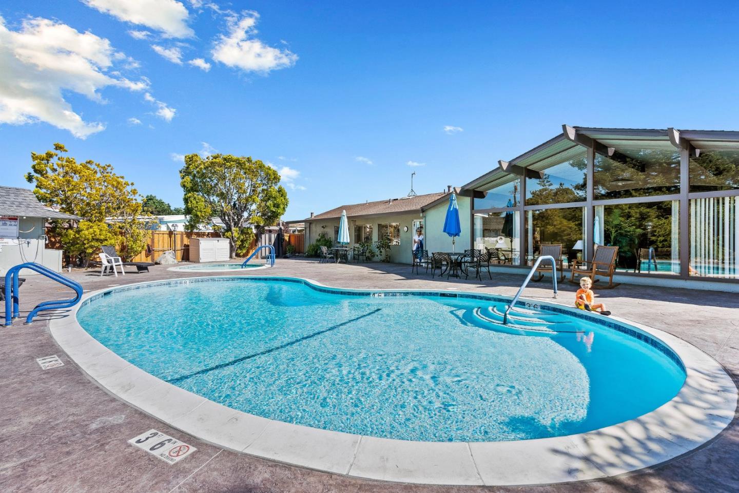 4160 Jade Street, Unit 90 Capitola, CA 95010 - Photo 17 of 18 a view of a house with swimming pool and sitting area