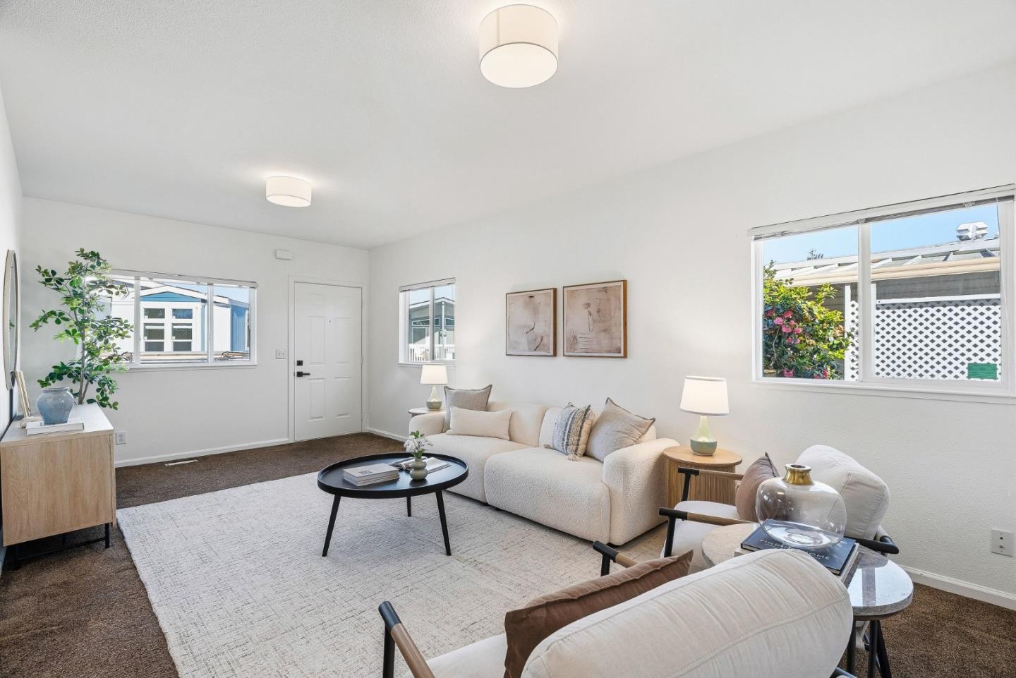 4160 Jade Street, Unit 90 Capitola, CA 95010 - Photo 4 of 18 a living room with furniture and a potted plant