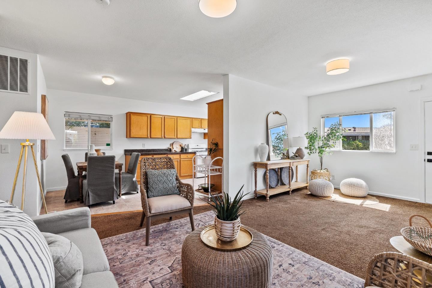 4160 Jade Street, Unit 90 Capitola, CA 95010 - Photo 4 of 18 a living room with furniture potted plant and a lamp