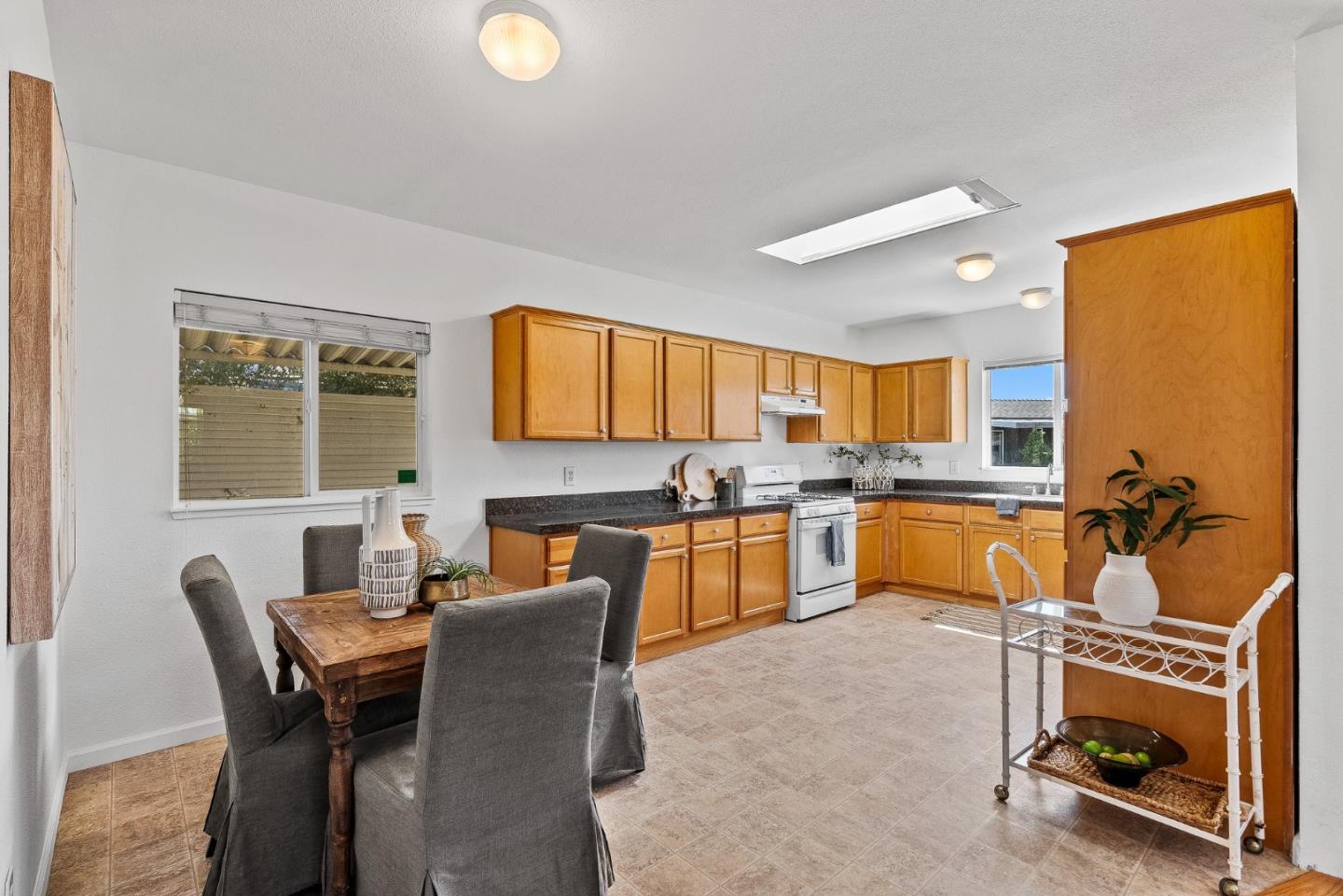 4160 Jade Street, Unit 90 Capitola, CA 95010 - Photo 5 of 18 a view of a dining room with furniture and a kitchen