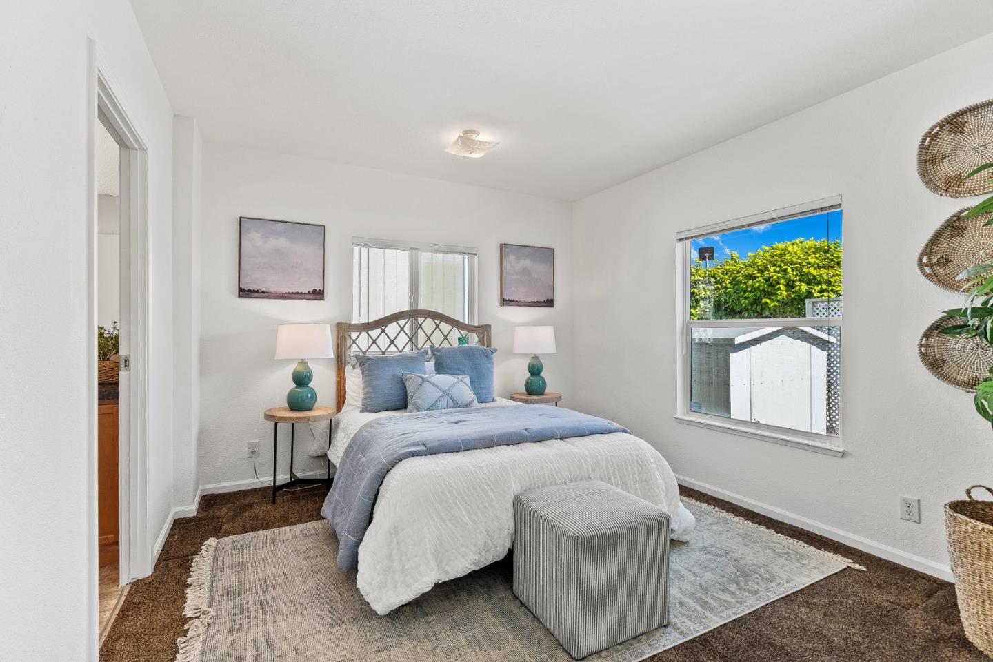 4160 Jade Street, Unit 90 Capitola, CA 95010 - Photo 10 of 18 a bedroom with a bed and a painting on the wall