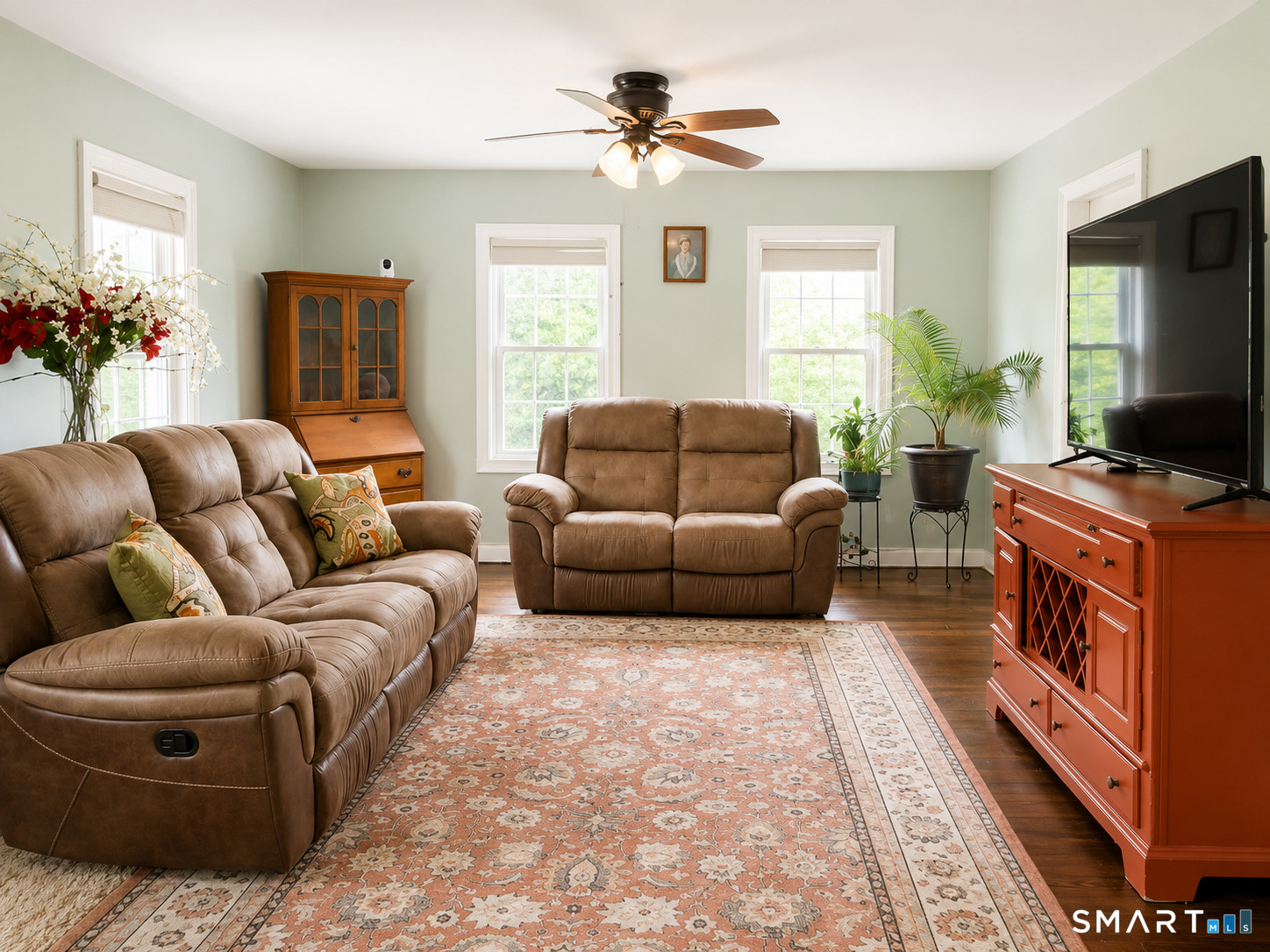 443 Amity Road Bethany, CT 06524 - Photo 22 of 30 a living room with furniture a flat screen tv and a window