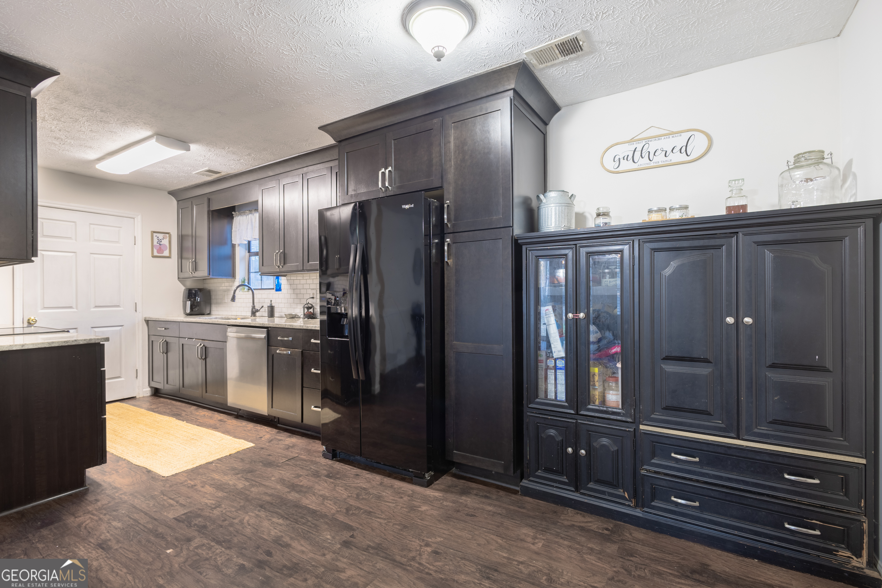 820 County Road 14 Muscadine, AL 36269 - Photo 12 of 20 a kitchen with stainless steel appliances granite countertop a refrigerator and a sink