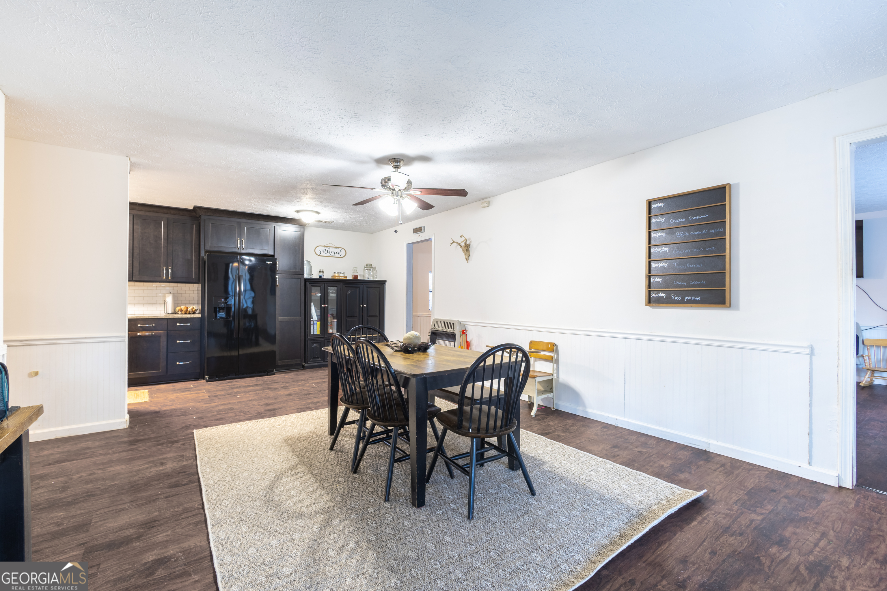 820 County Road 14 Muscadine, AL 36269 - Photo 14 of 20 a view of a dining room with furniture and wooden floor