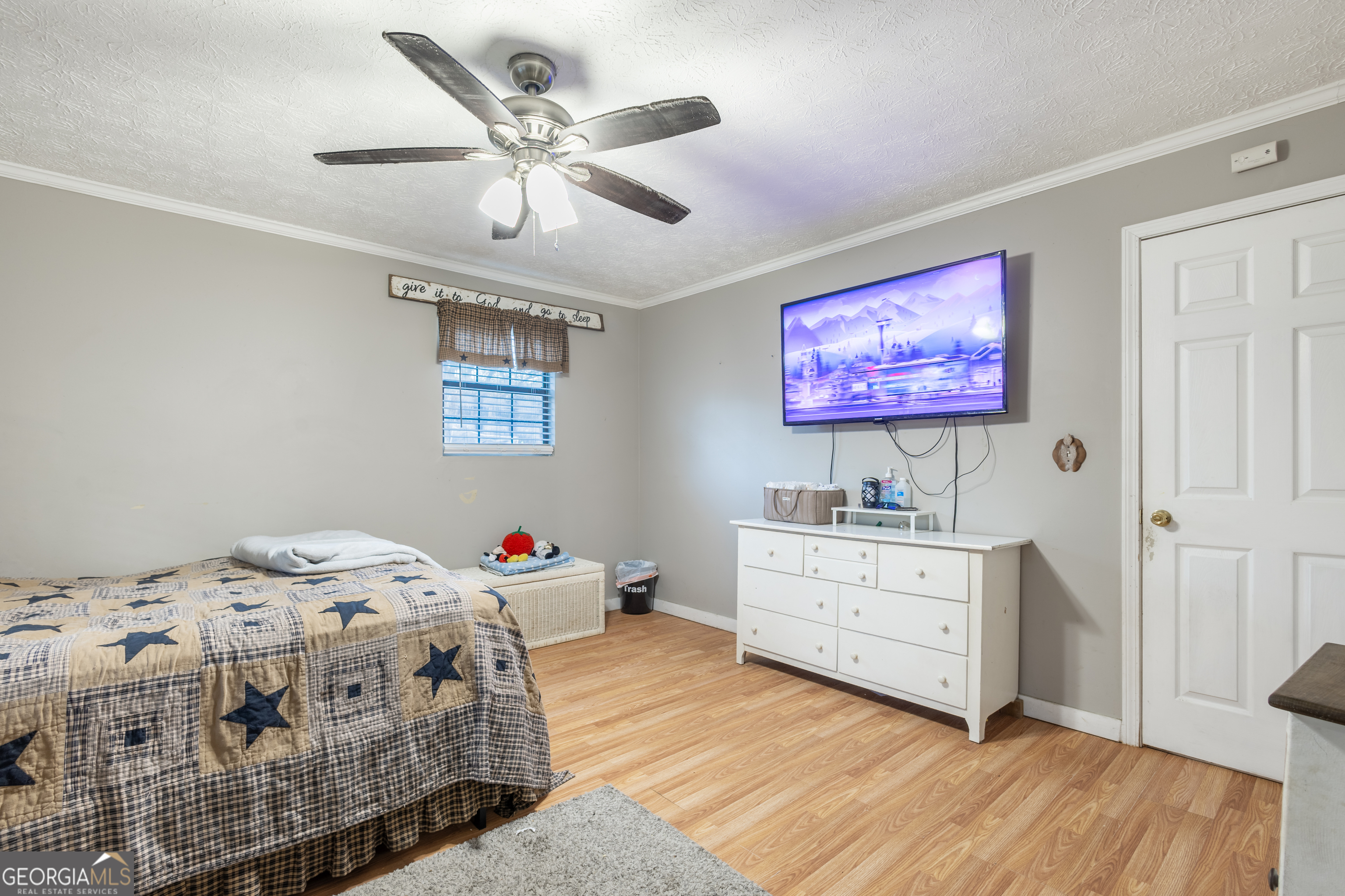 820 County Road 14 Muscadine, AL 36269 - Photo 20 of 20 a bedroom with a bed and a dresser in it