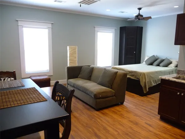 a bedroom with a bed and a couch
