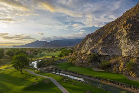 a view of a grassy area with an ocean