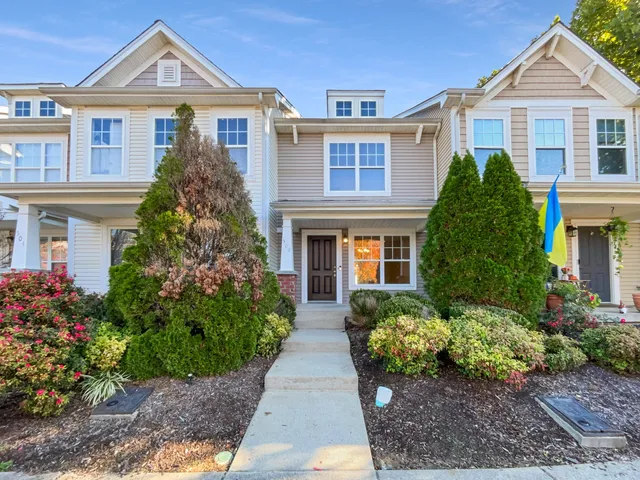 a front view of a house with garden