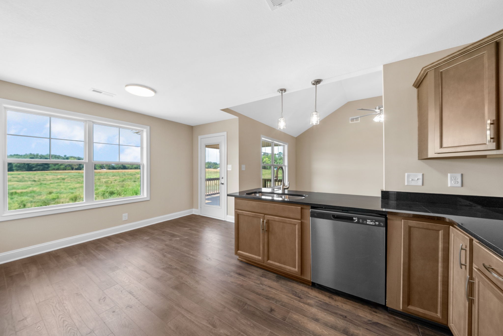 34 Echo Ridge Oak Grove, KY 42262 - Photo 13 of 33 a kitchen with granite countertop a stove a sink and wooden floor