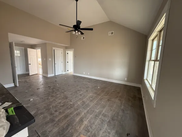 a view of an empty room with a window