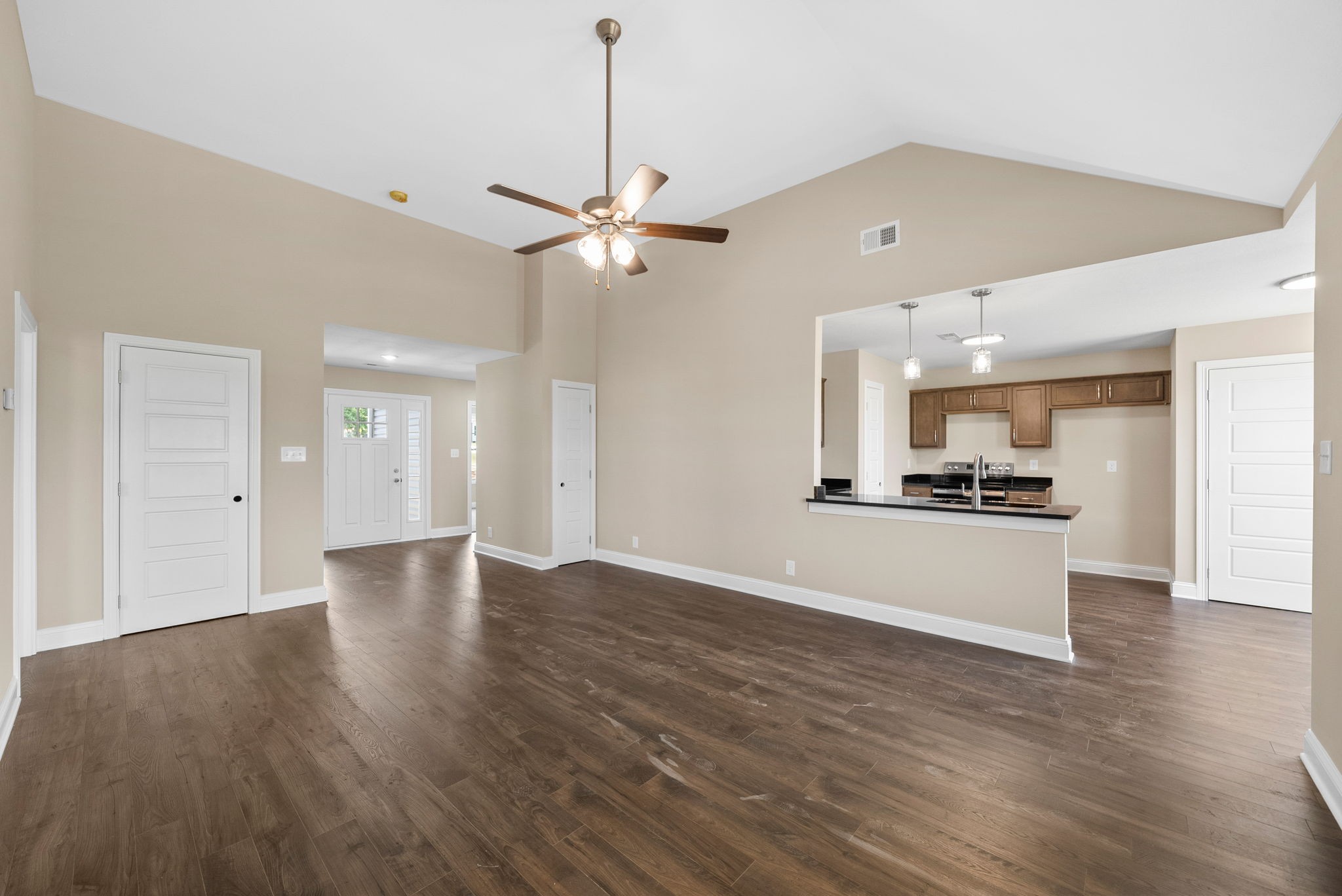 34 Echo Ridge Oak Grove, KY 42262 - Photo 5 of 33 a view of an empty room and kitchen with wooden floor