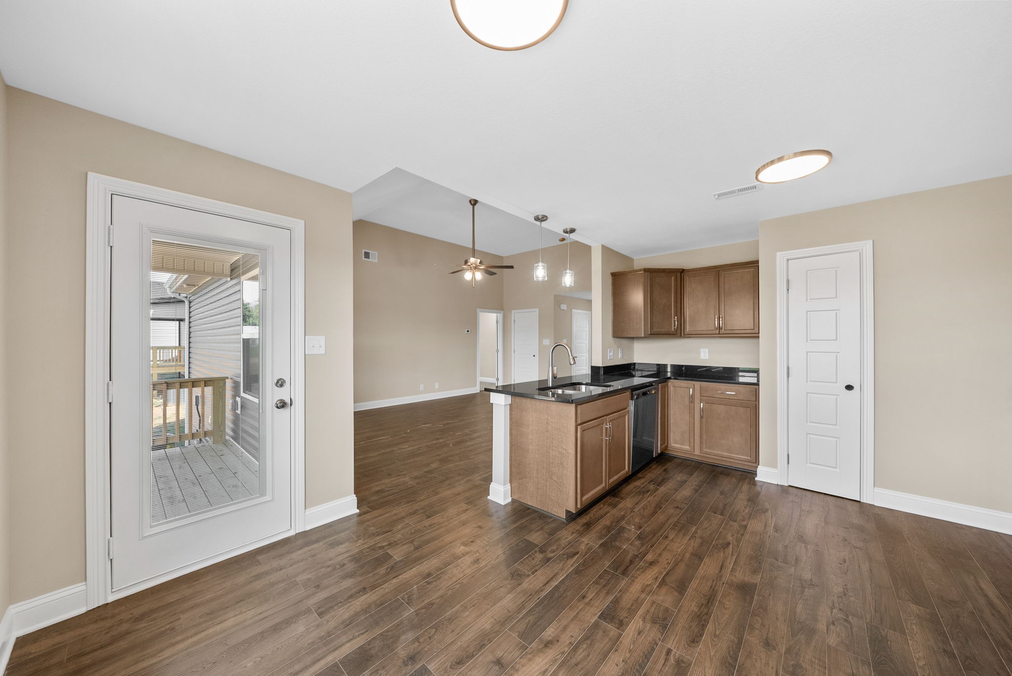 34 Echo Ridge Oak Grove, KY 42262 - Photo 8 of 33 a large kitchen with a wooden floor and a refrigerator