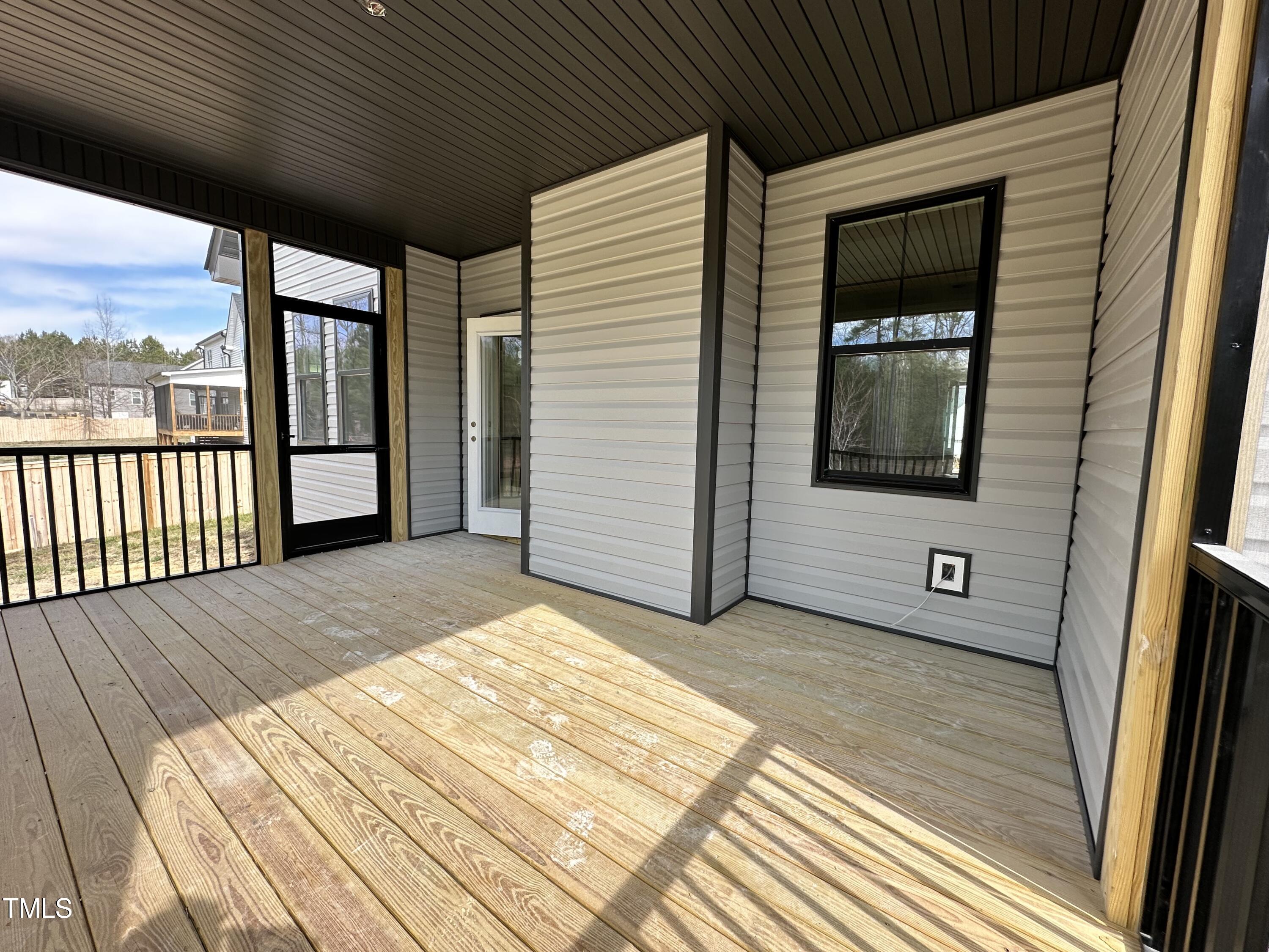 60 Pilot Ridge Road Zebulon, NC 27597 - Photo 2 of 7 a view of a balcony with wooden floor and fence