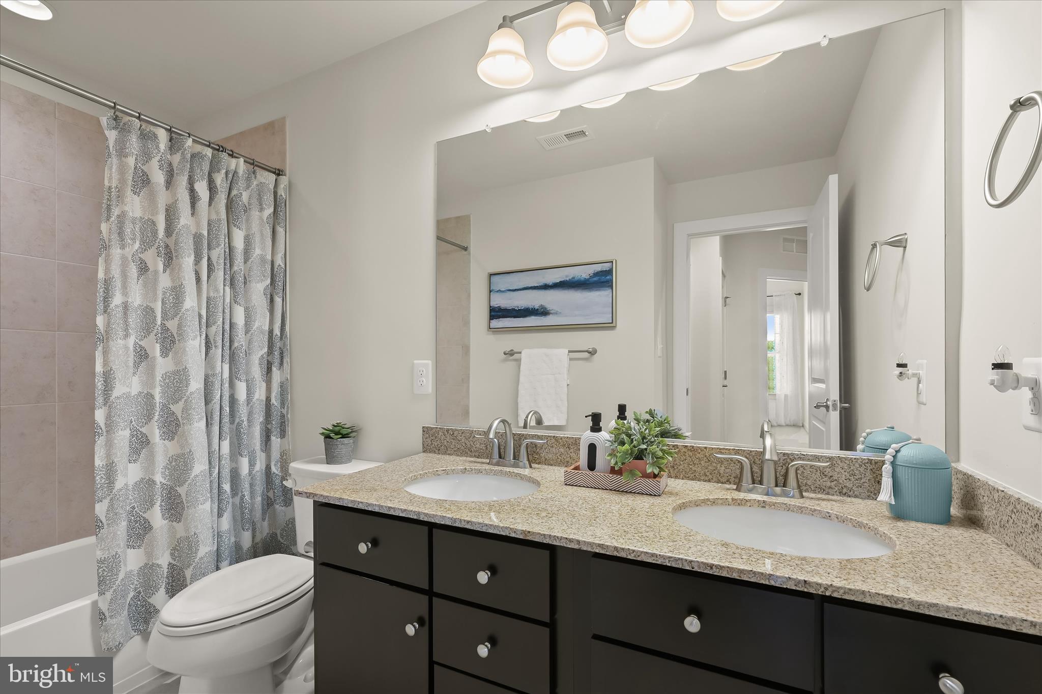11285 Terrace Lane Fulton, MD 20759 - Photo 37 of 52 a bathroom with a granite countertop sink a toilet and a mirror