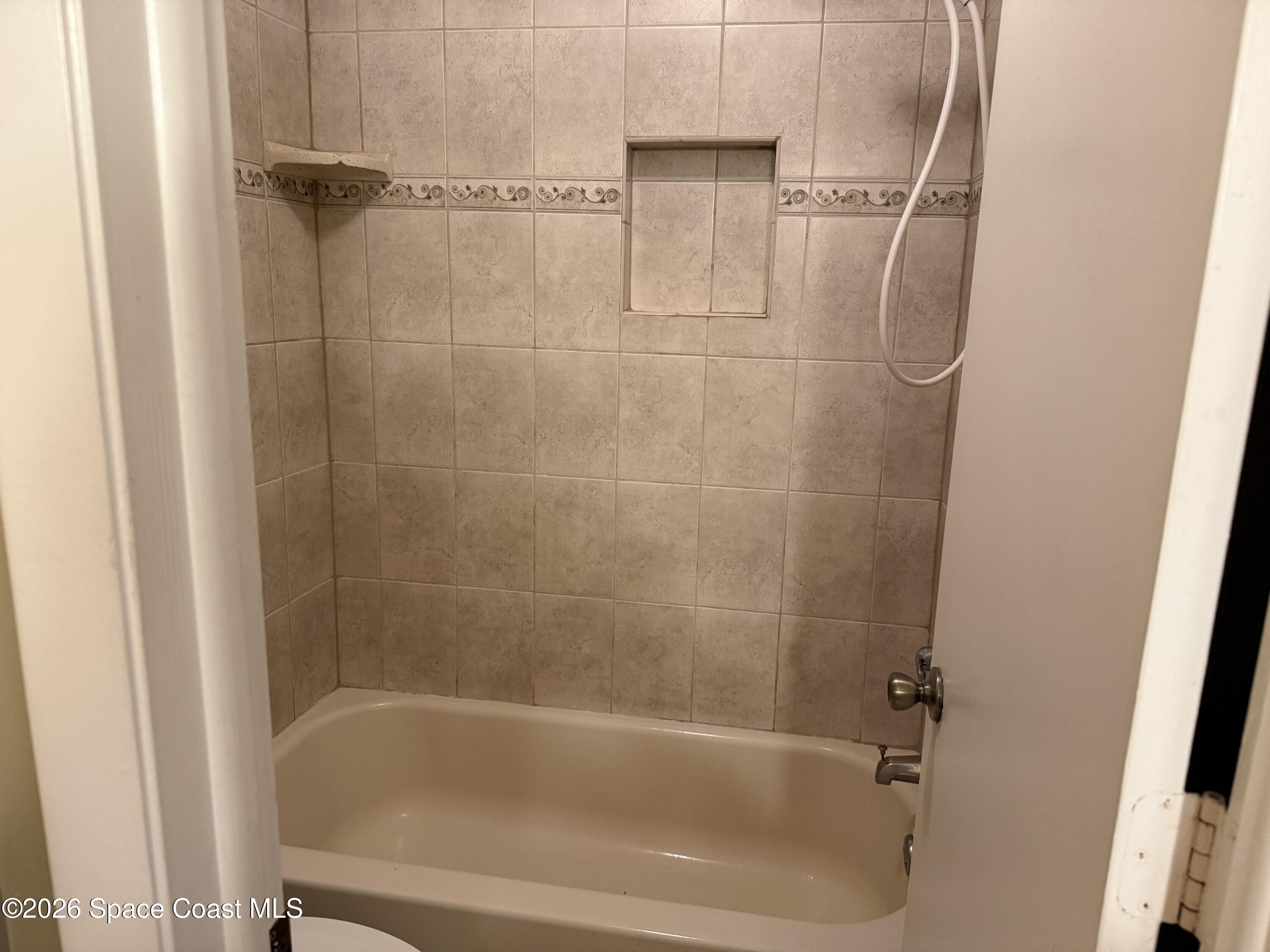 1461 Sheafe Avenue Northeast, Unit 106 Palm Bay, FL 32905 - Photo 11 of 13 a close view of a bathtub in bathroom