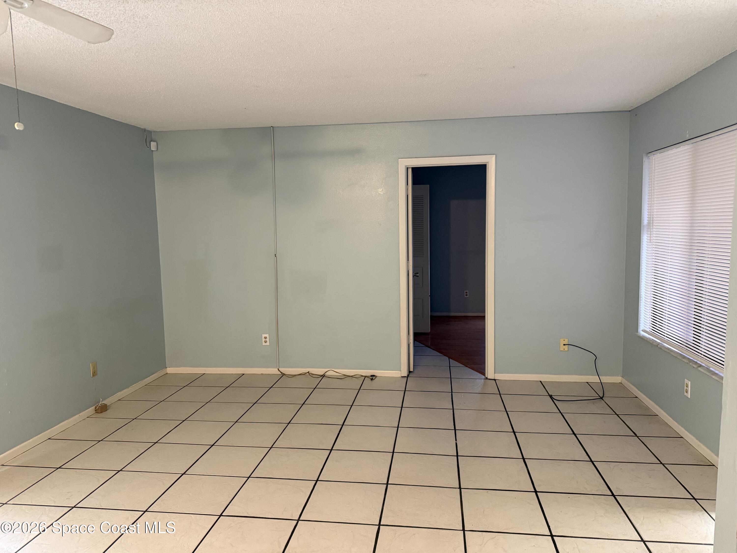 1461 Sheafe Avenue Northeast, Unit 106 Palm Bay, FL 32905 - Photo 7 of 13 a view of an empty room