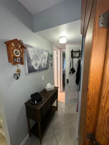 a living room with a furniture and a rug