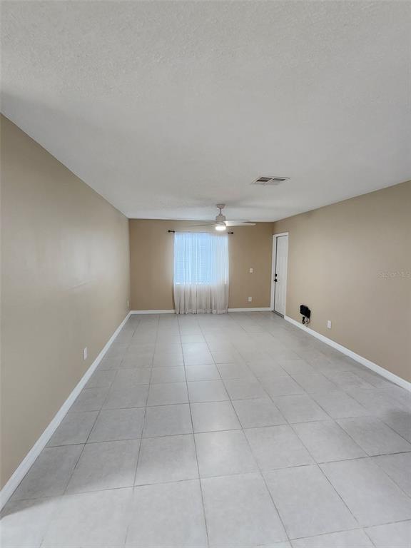 211 Thorntree Place Brandon, FL 33510 - Photo 5 of 16 an empty room with a empty space and windows