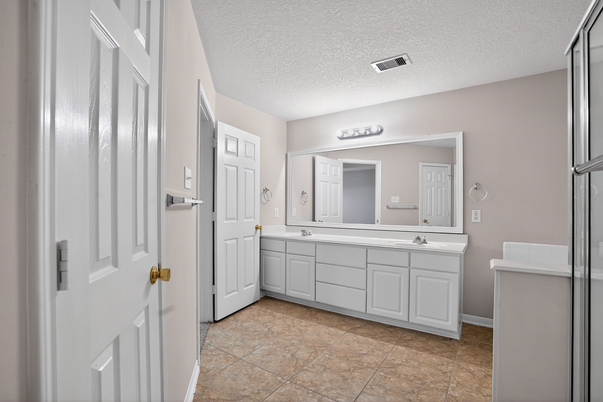 29414 Winton Wood Way Spring, TX 77386 - Photo 13 of 35 a spacious bathroom with a double vanity sink and a mirror