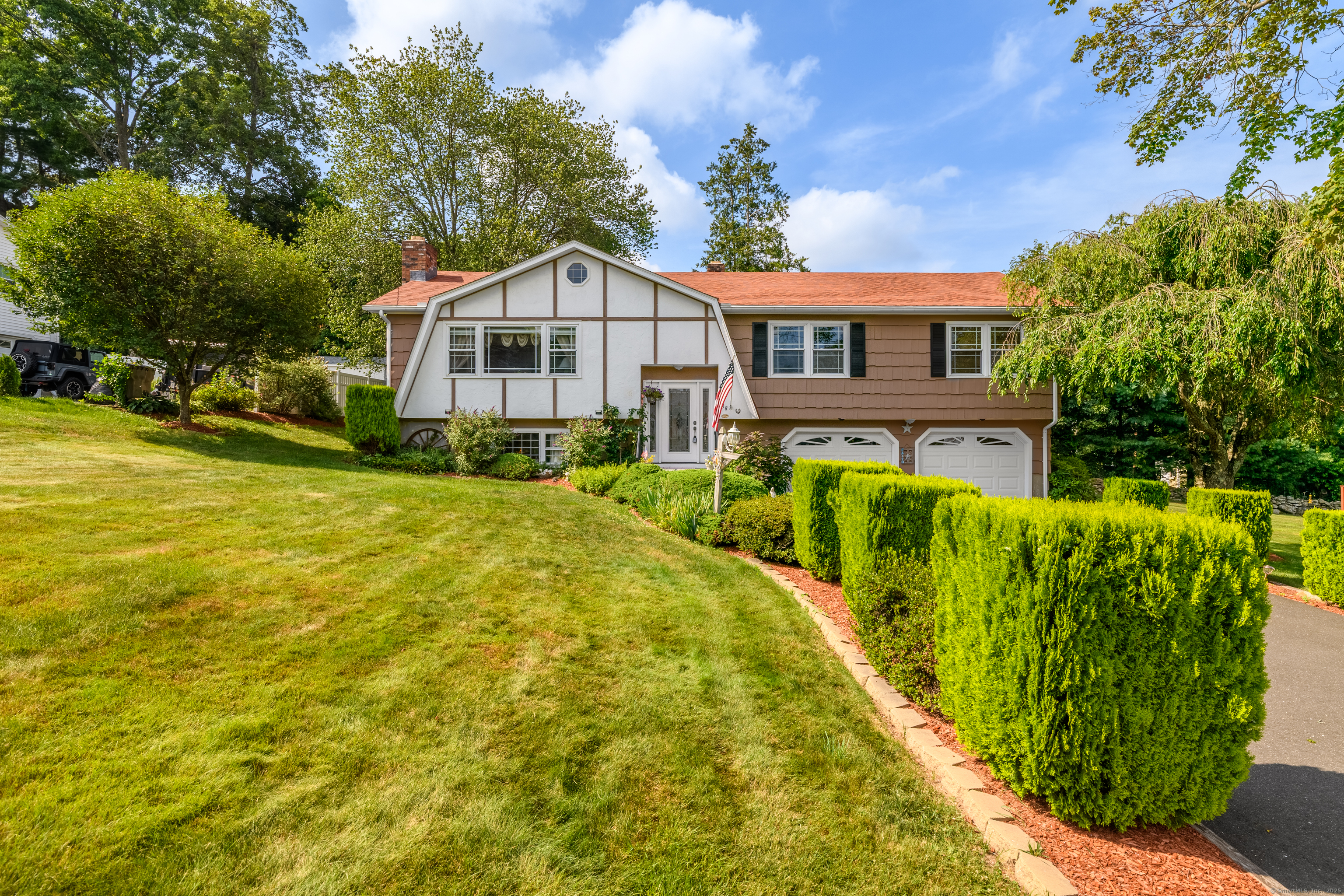 38 Pine Street Trumbull, CT 06611 - Photo 1 of 1 a front view of a house with a yard