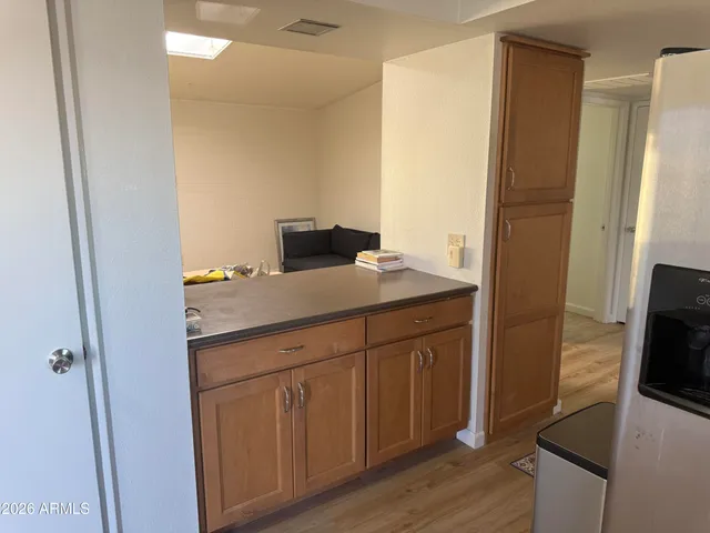 a kitchen with a sink and a refrigerator