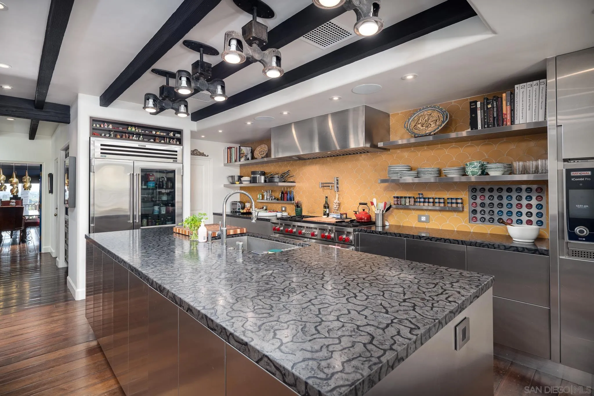 18245 Paseo Victoria Rancho Santa Fe, CA 92067 - Photo 15 of 40 a kitchen with a table and chairs in it
