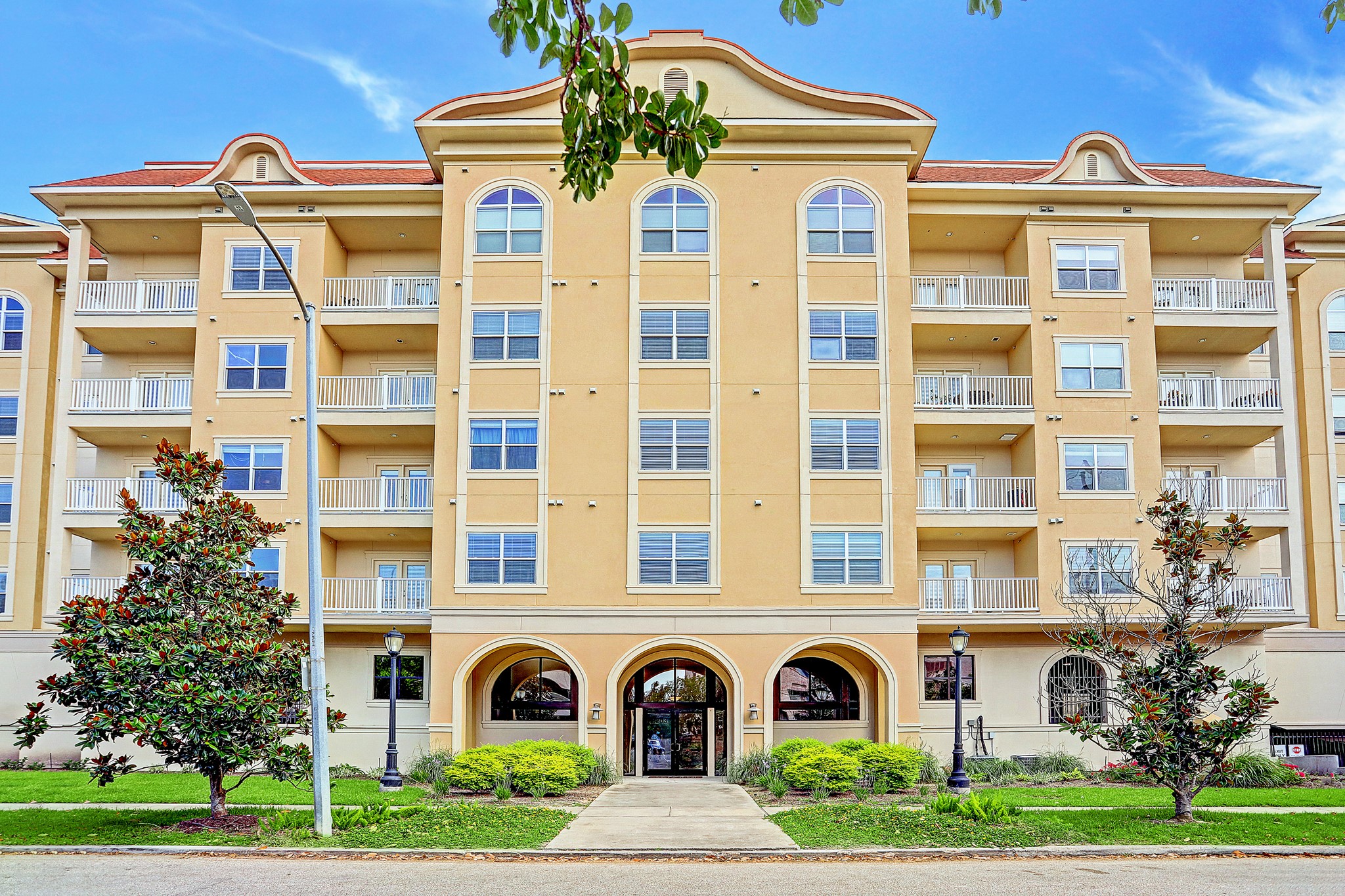 a front view of a multi story residential apartment building