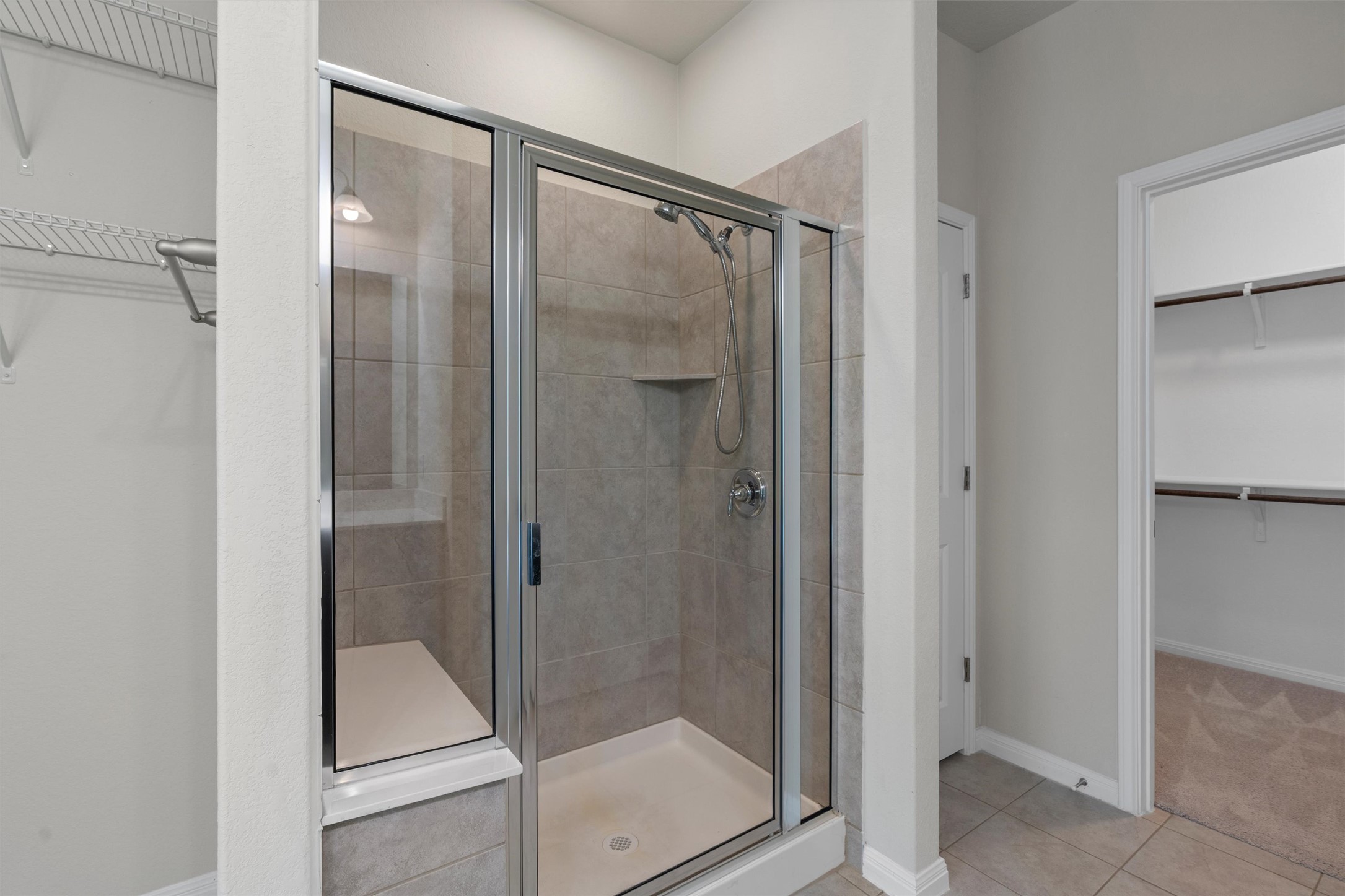 108 Calhoun Lane Georgetown, TX 78633 - Photo 19 of 32 a bathroom with a glass shower door