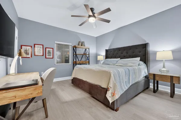 a bed room with a bed and a chair
