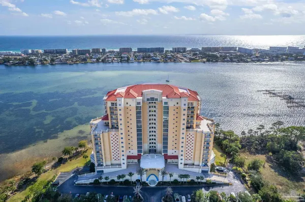 an aerial view of a house with a lake view
